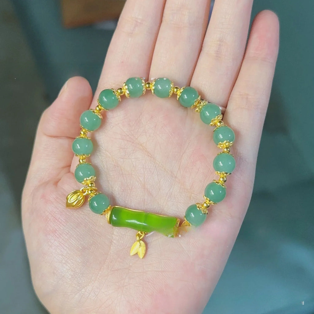 Retro style Ruyi floral bracelet made from coloured glaze and glass in beige, green, light green, or white.