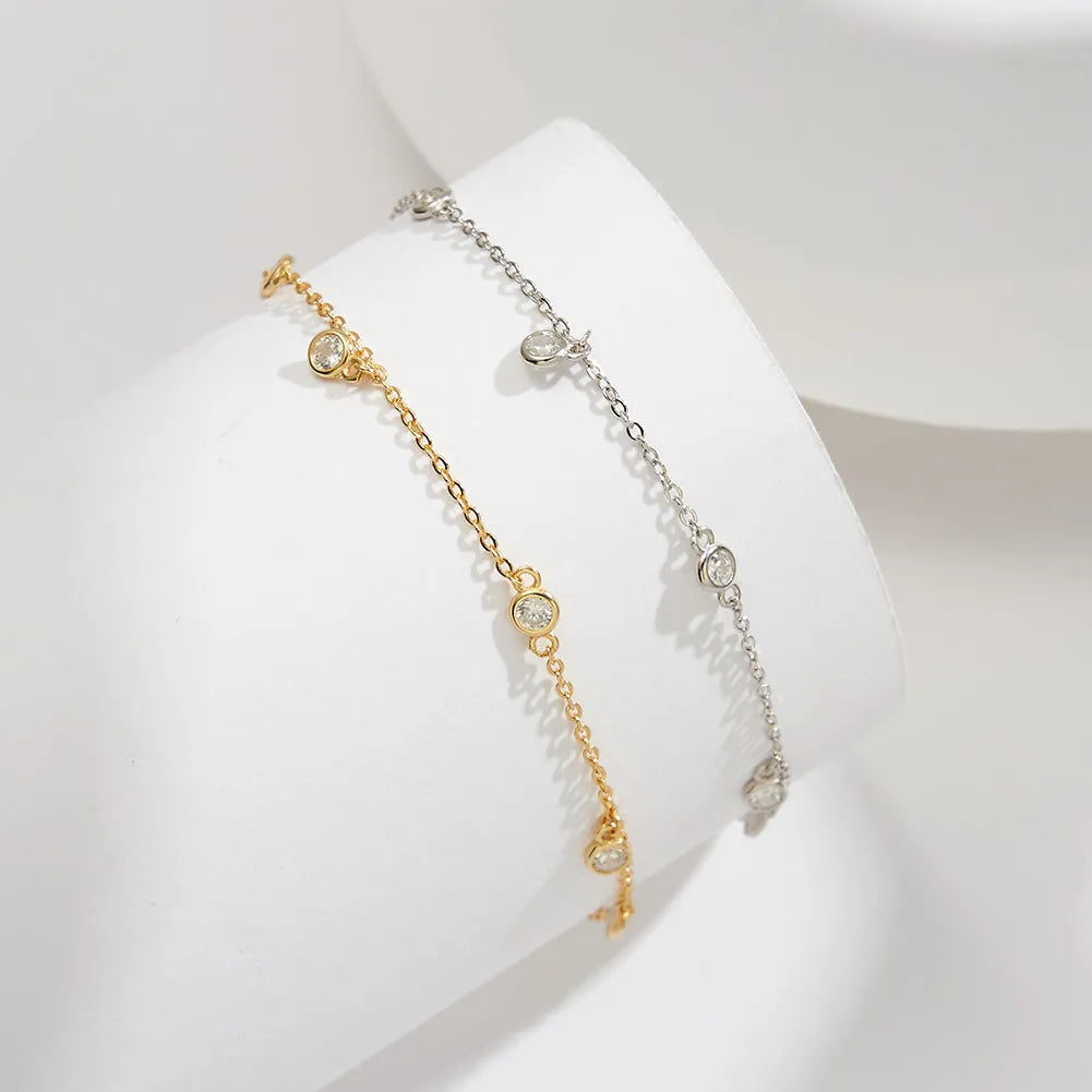 Women's sterling silver anklet with a small geometric zirconium pendant in a gold or white gold colour.