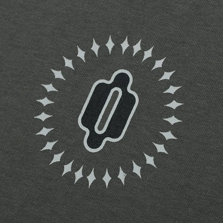 Man wearing a grey khaki loose-fit cotton pullover with a drop shoulder design and letter print.