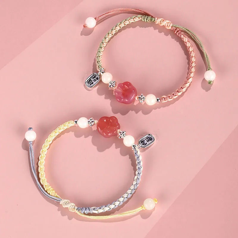 Red cat's paw charm couple bracelet in pastoral woven style with pink or yellow options