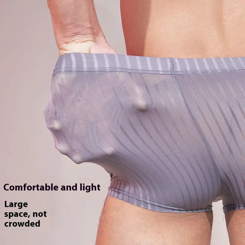 Men's striped transparent boxer briefs in black, white, and dark grey on a plain background.