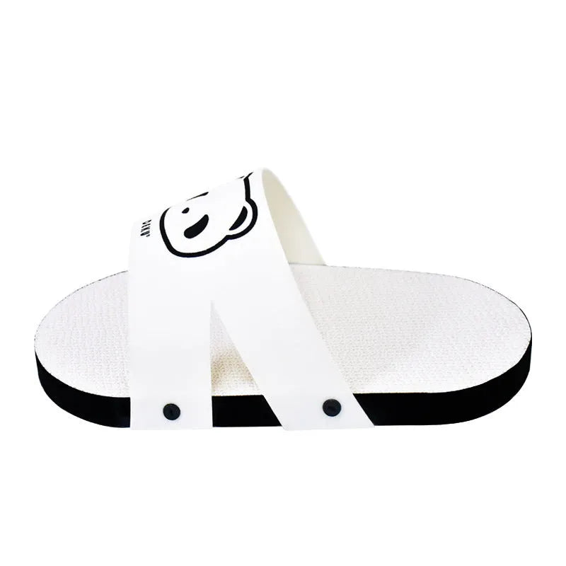 White slipper-style corrugated paper cat scratch board on a flat surface.