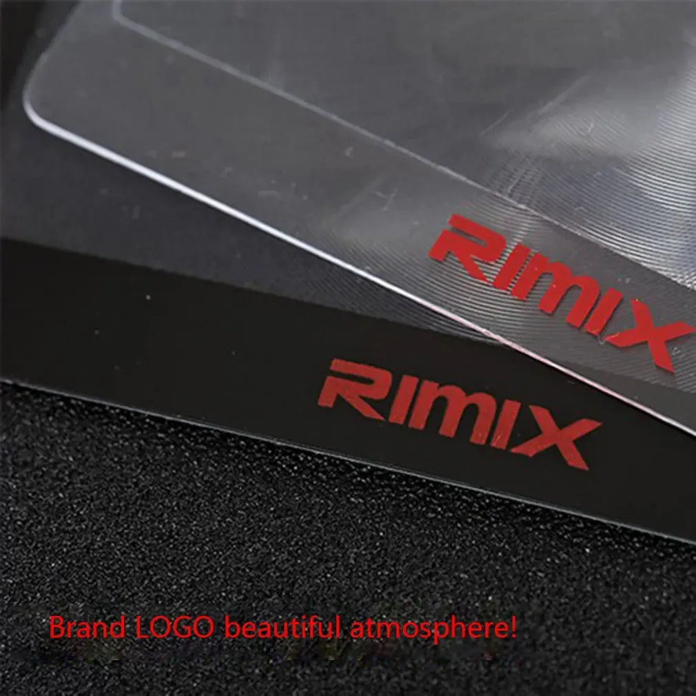 A thin, credit-card sized black plastic magnifier with a Fresnel lens, shown next to a bank card for scale.