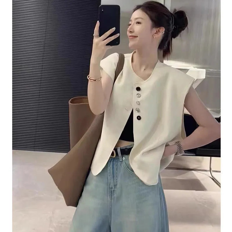 Women's short length polyester vest in milky white with front pockets