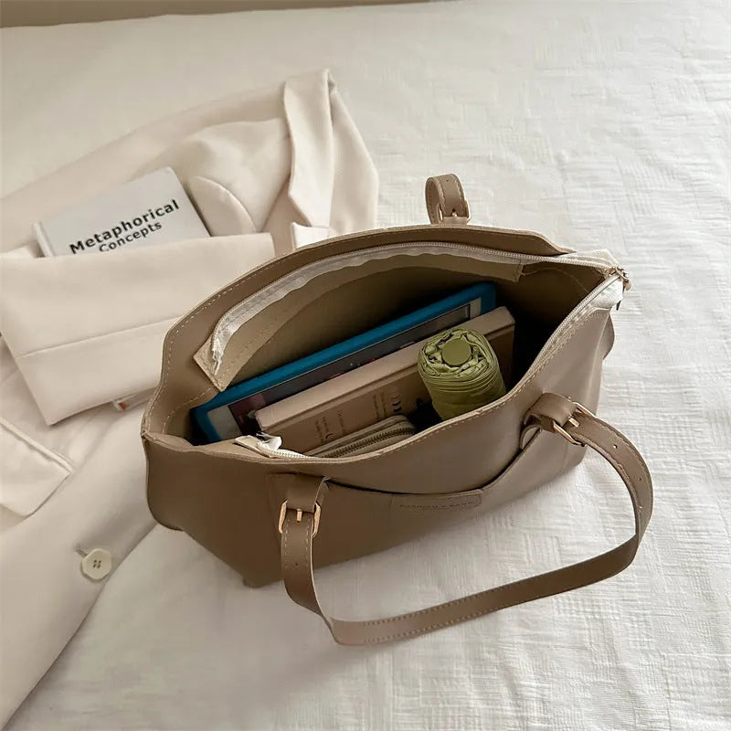 PU tote bag in horizontal square shape with double shoulder straps and visible sewing line detailing