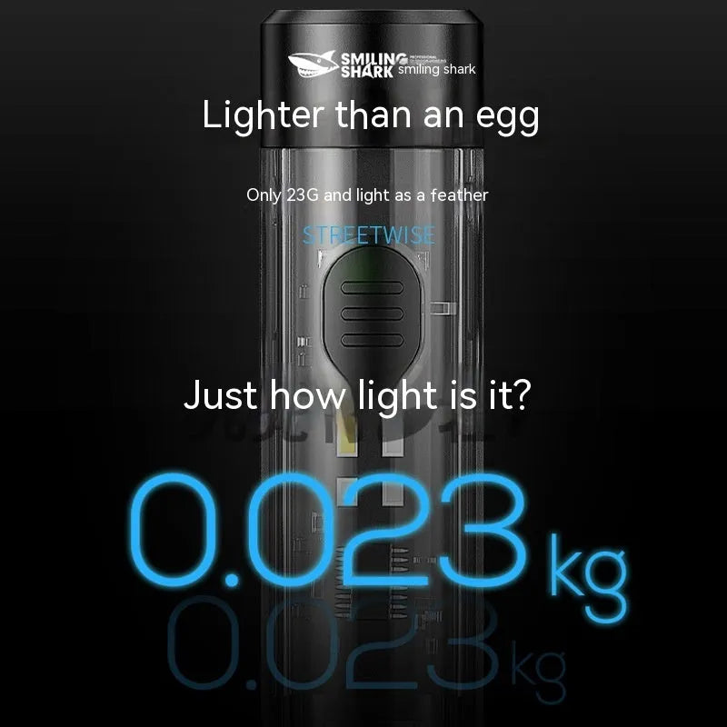 Black plastic portable outdoor flashlight with USB charging cable.