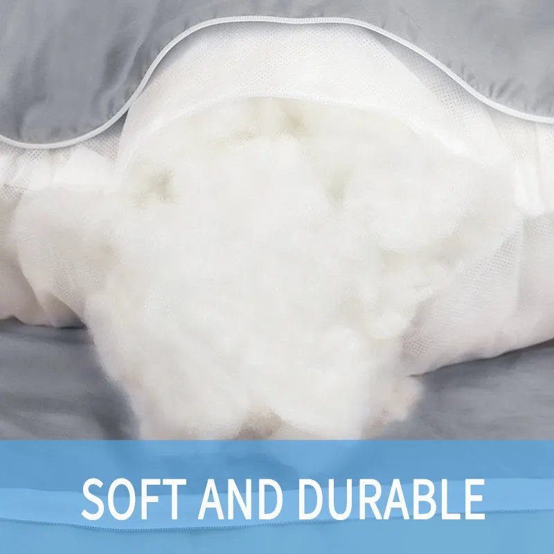 U-shaped pregnancy pillow in light blue ice silk fabric on a bed.