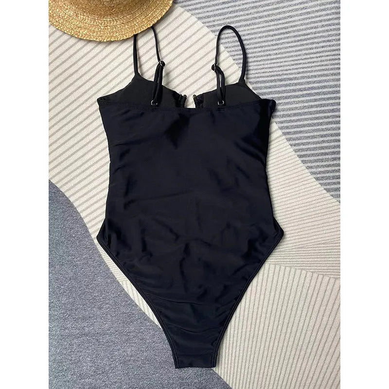 Black women's one-piece swimsuit with solid colour design for swimming activities