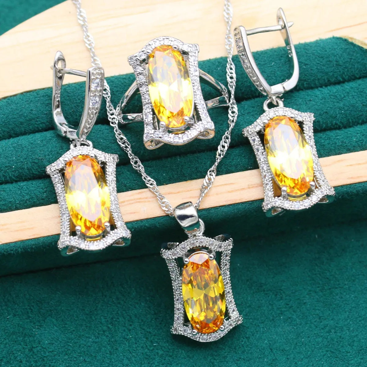 Women's anti-allergy zircon jewellery set with snake bone chain necklace, matching earrings, ring and bracelet in yellow or olive.