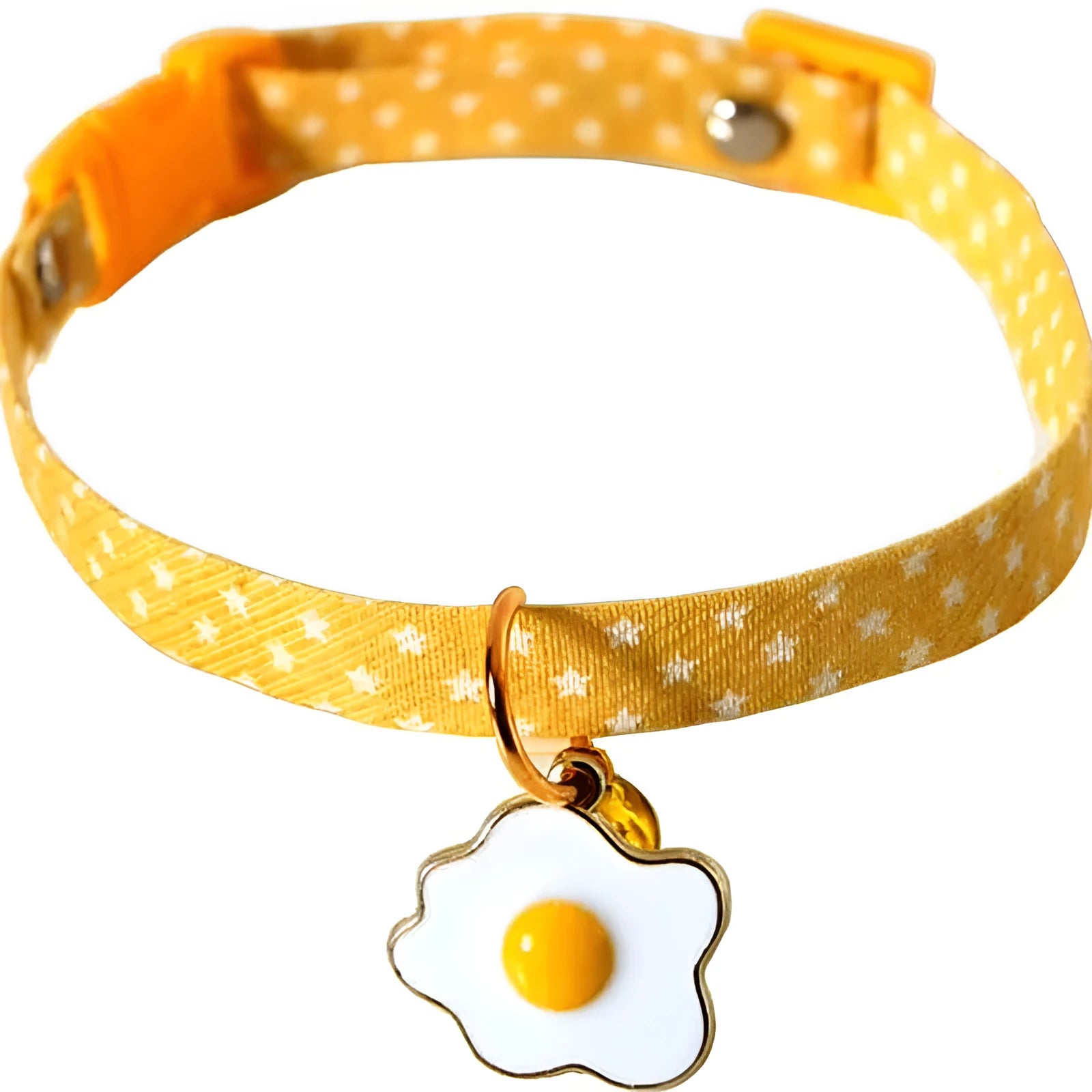 Green adjustable cat collar with bell pendant and bow tie on a small dog