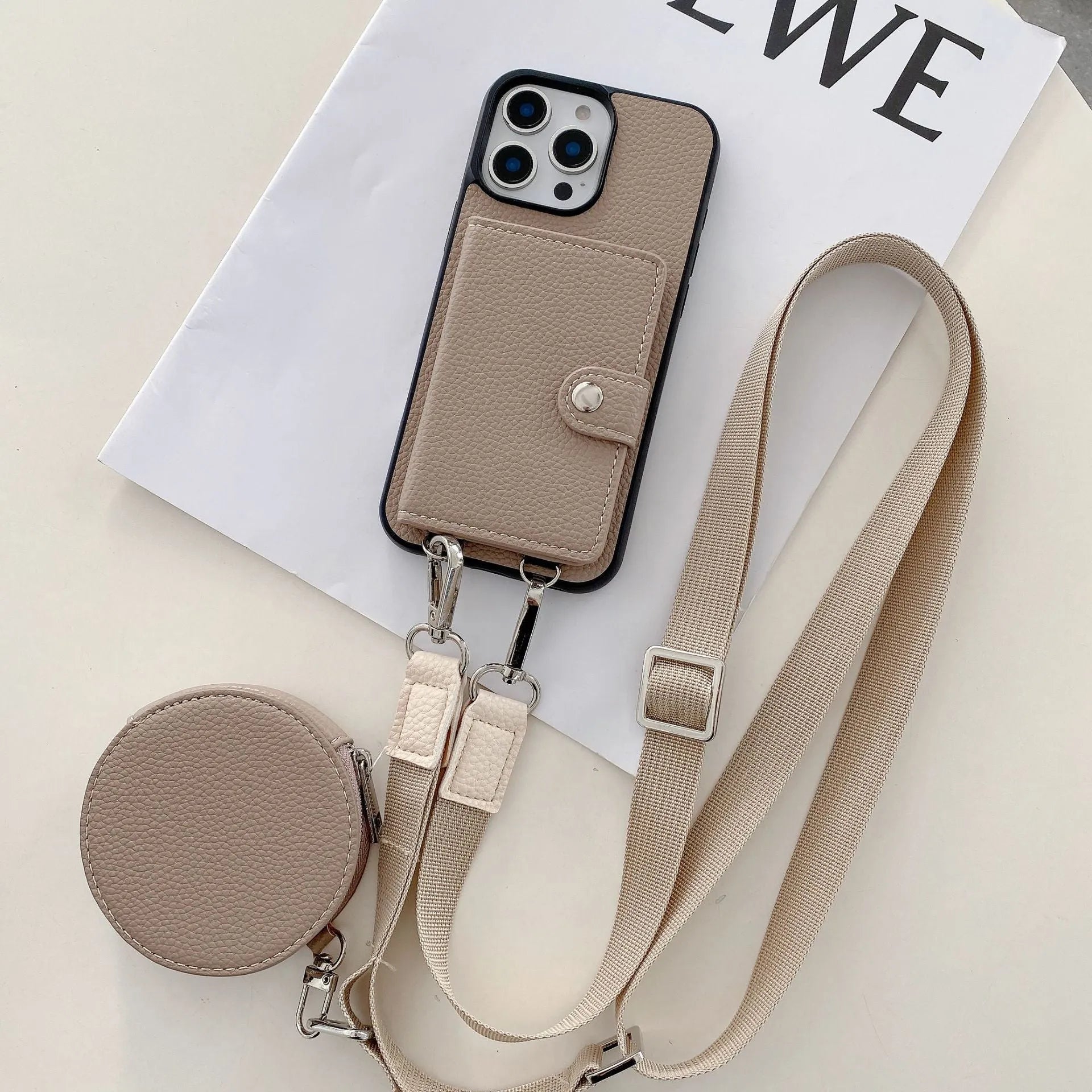 Black PC leather card holder phone case for iPhone with wrist lanyard attached.