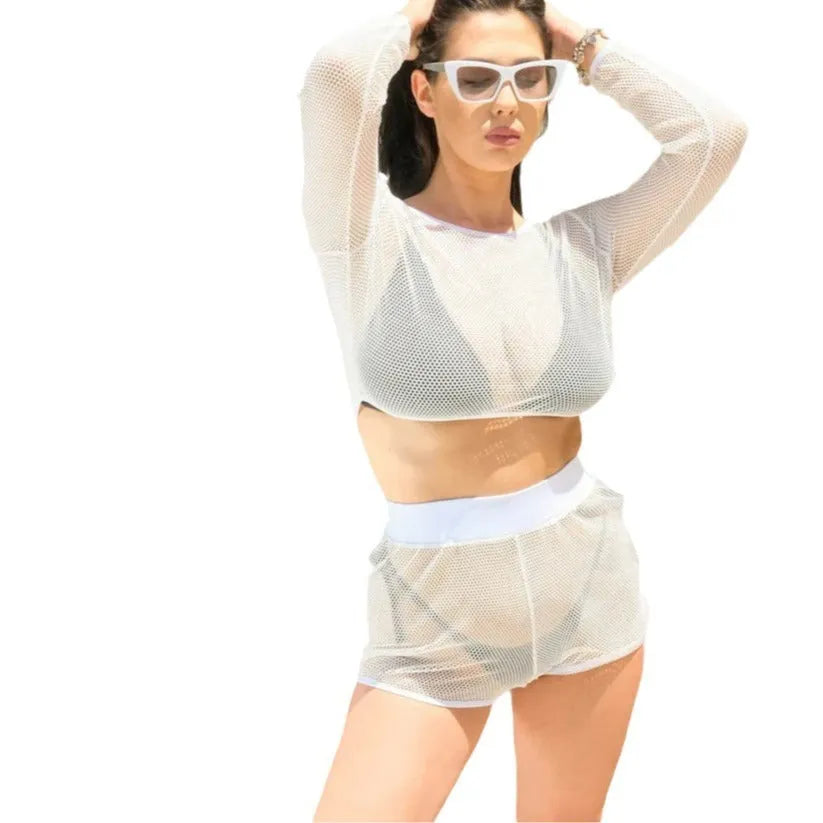 White transparent mesh women's beach swimsuit with skirt, shown for sunbathing.