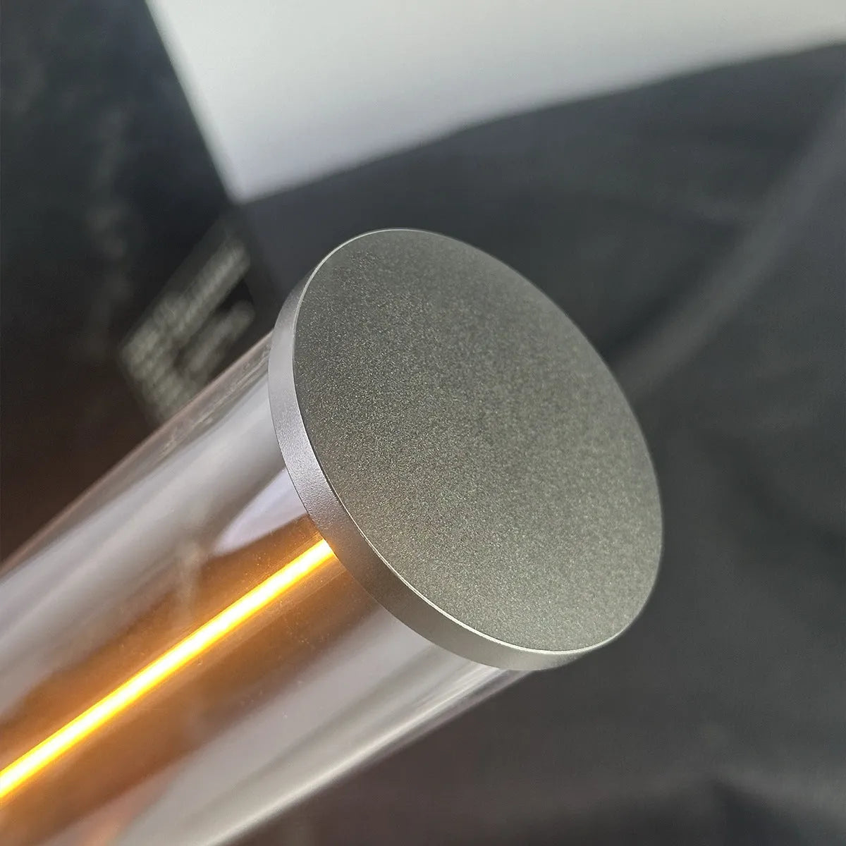 Slim warm white LED light strip with magnetic base for USB charging and attachment to metal surfaces.