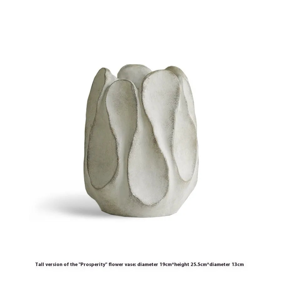 Irregular shaped art ceramic vase for flower arrangements in low and high style options.