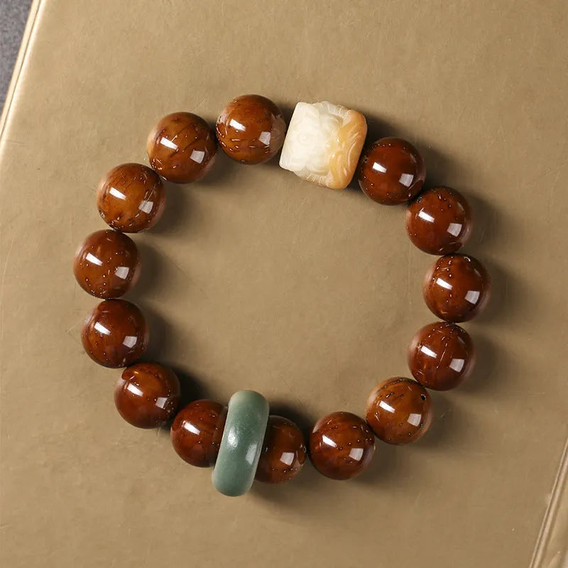 Hand-woven 13mm round bead bracelet in ivory nut lion style with single circle design