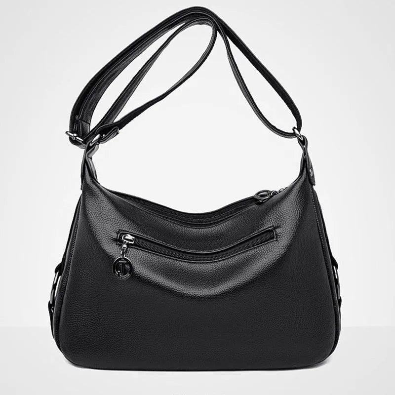 Large blue PU crossbody shoulder bag with multiple internal compartments and luggage-style design