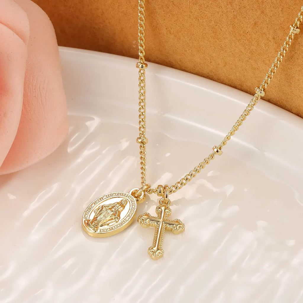 Virgin Mary cross necklace with geometric pendant in gold colour