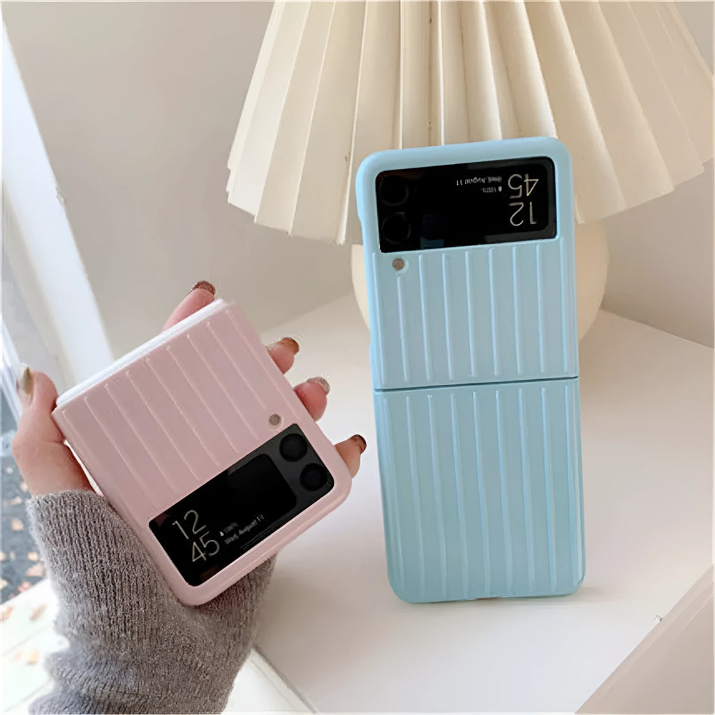 Ultra-thin black flip phone case for Samsung Z Flip3 folding mobile on a table.