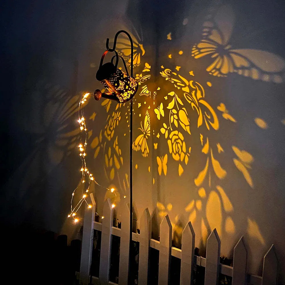 Solar-powered iron garden lamp with a tapered butterfly design in warm white.