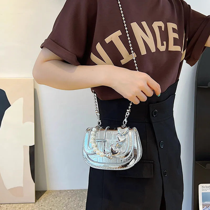 Women's silver PU mini saddle crossbody bag with phone pocket and single shoulder strap