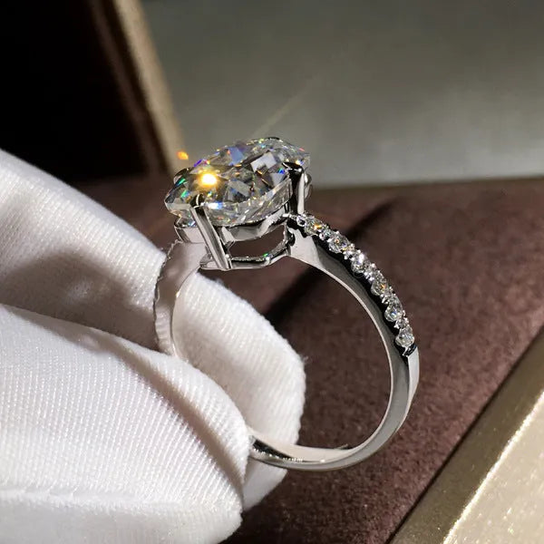 Women's moissanite four-prong princess cut ring in white gold colour on copper band, size no.7