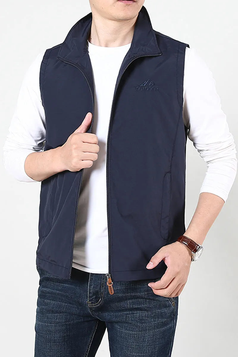 Men's loose-fitting thin waistcoat vest in a solid colour with side seam pockets.