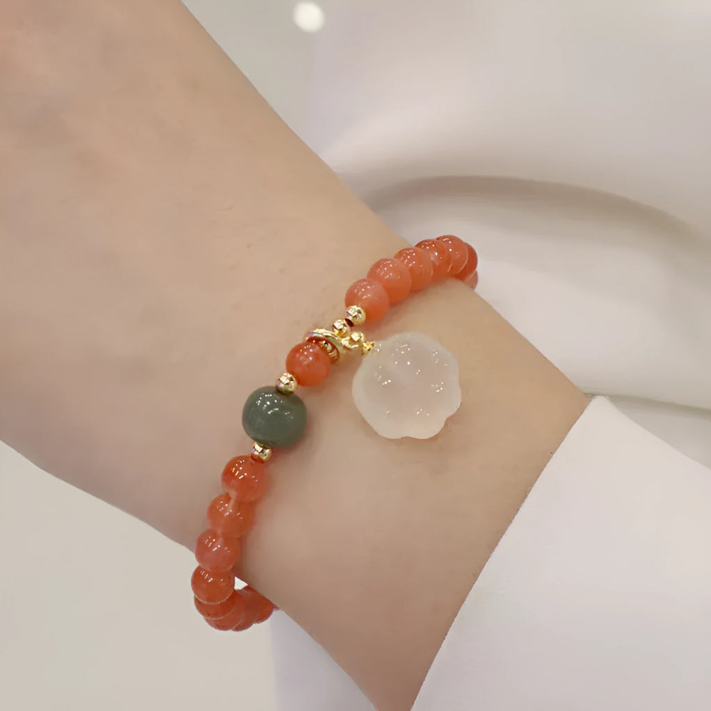 Women's natural red agate bracelet with 8mm cat's paw charms and complementary jade bracelet