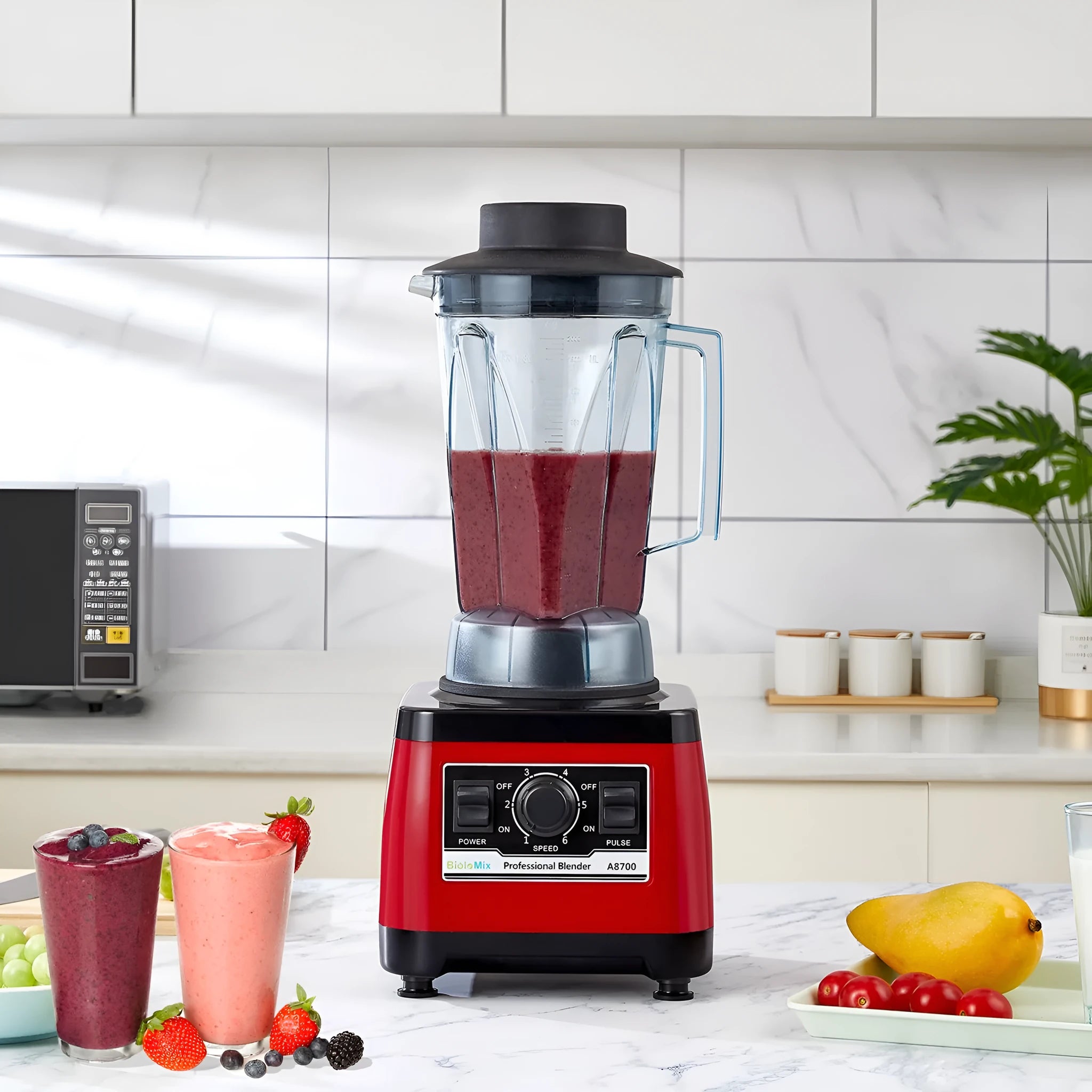 Red commercial heavy-duty blender with 2200W motor and 2-litre capacity jar on counter.