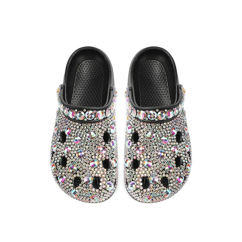 Black women's platform sandals with rhinestone decoration and a perforated slider design.