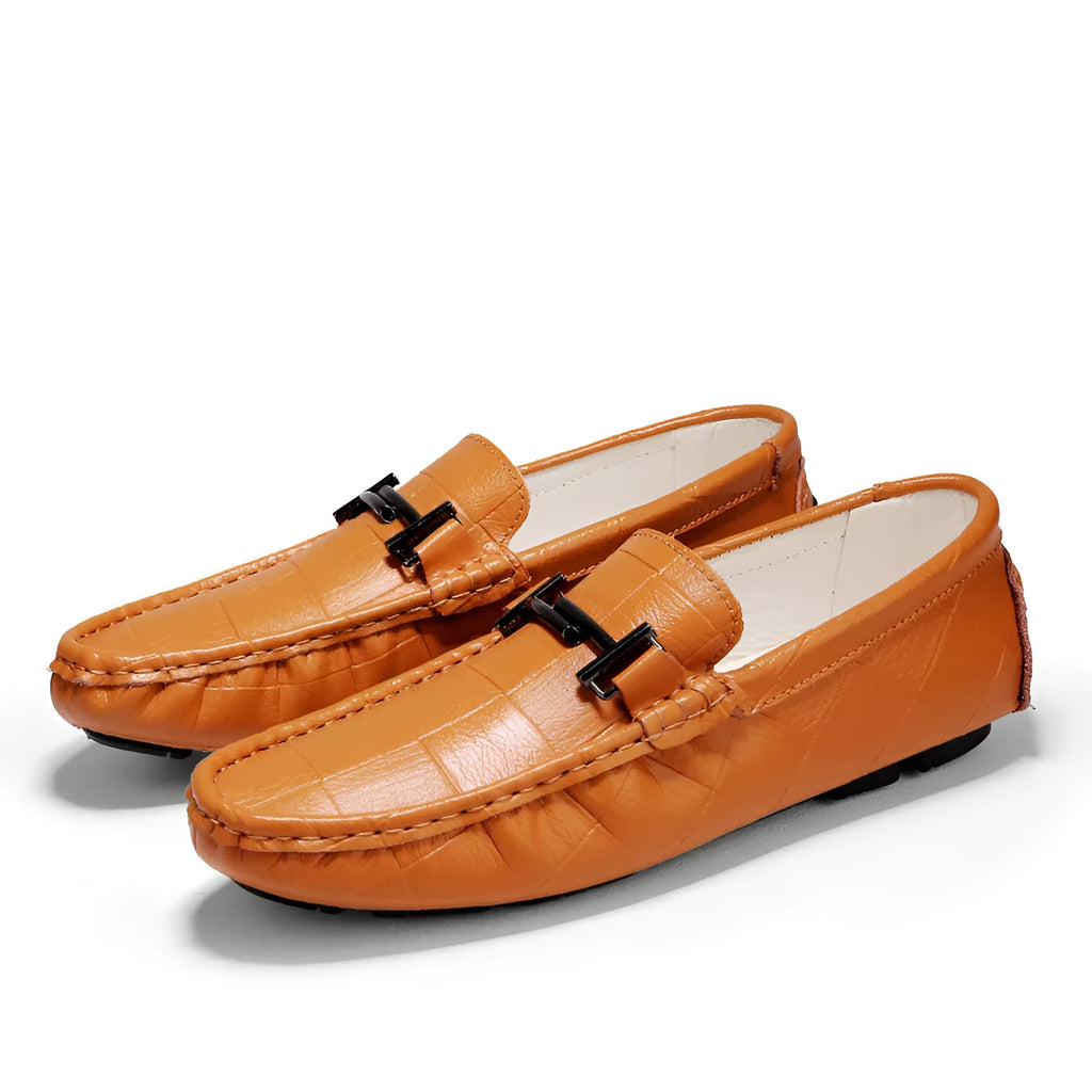 Men's leather loafers with belt buckle detail in multiple colours showing slip-on design