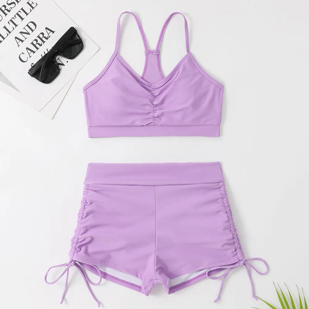 Women's high waisted split leg bikini swimsuit in black or purple colours