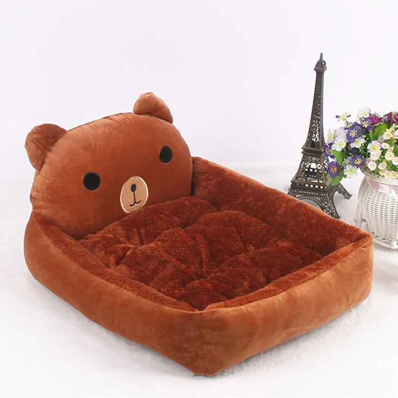Blue cartoon-style washable pet bed with raised sides and soft fleece interior for small dogs or cats.