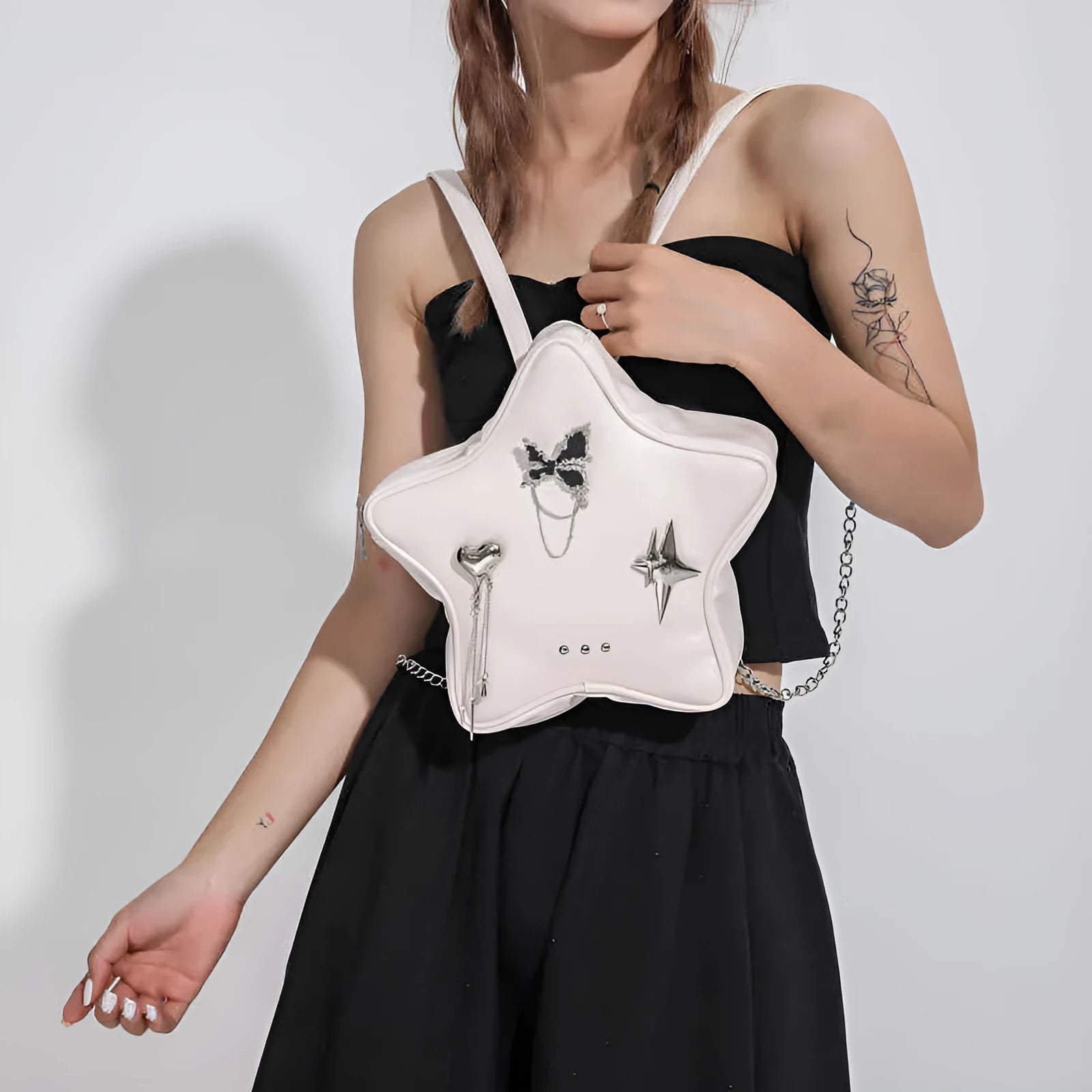 Women's soft PU messenger mini backpack in black, white or silver with shoulder and crossbody straps