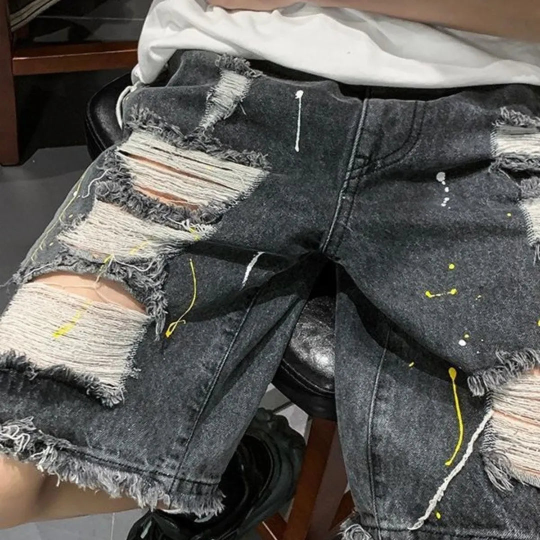 Men's black denim shorts with water-washed hole design and loose street style fit