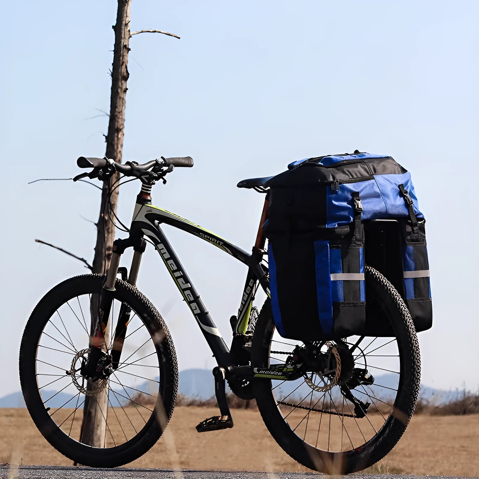 Rhinoceros brand green 70 litre bicycle rear frame storage bag mounted on a bike for touring.