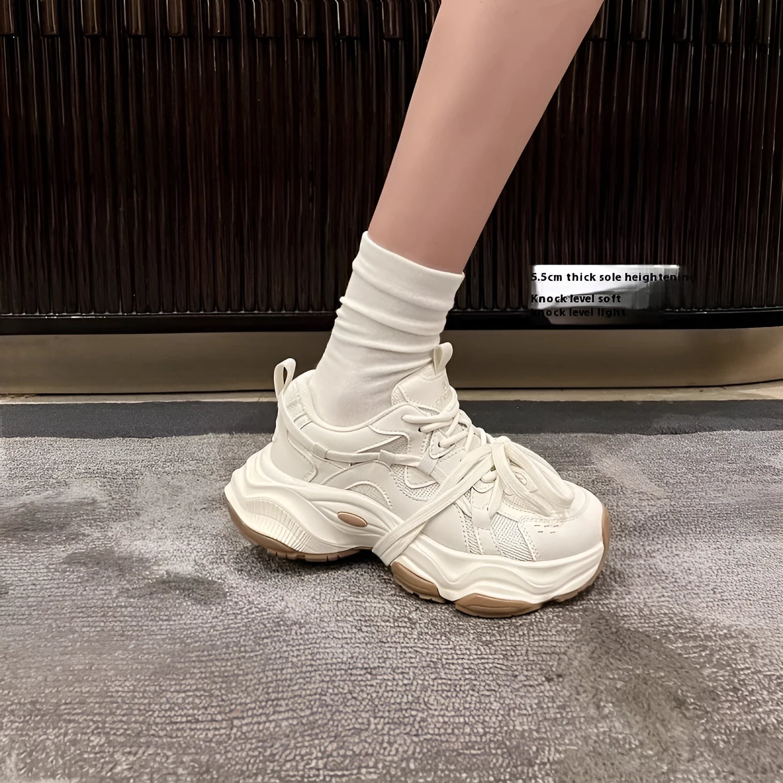 Milky white women's platform heel dad sneakers with round toe and front laces on a solid background.