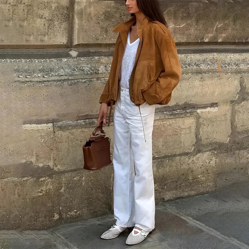 Man wearing a solid colour loose-fit retro style polyester jacket