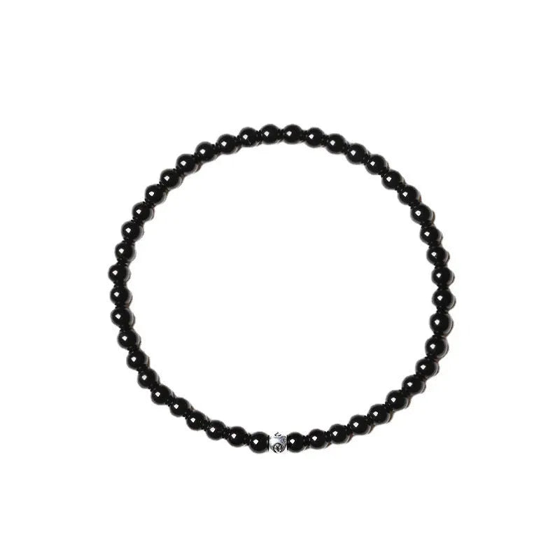 Fine unisex bracelet with blue San, black agate, and obsidian beads in a geometric 4mm design.