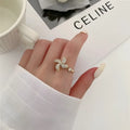 Rotating copper ring with geometric windmill design in gold or silver colour