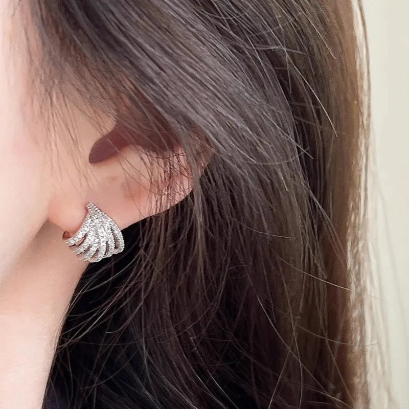 Women's geometric line design earrings with platinum electroplating and zircon construction