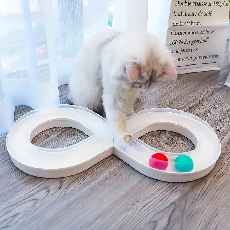 Blue and white plastic cat turntable track toy with balls and a feather teaser wand.