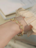 Handcrafted natural Hetian jade bracelet showing bead and charm style variations