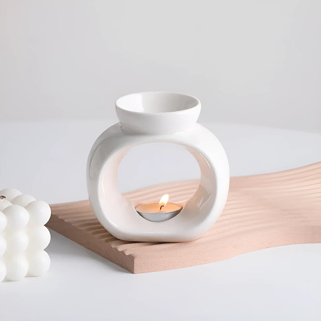 White Nordic style ceramic aromatherapy stove ornament on display