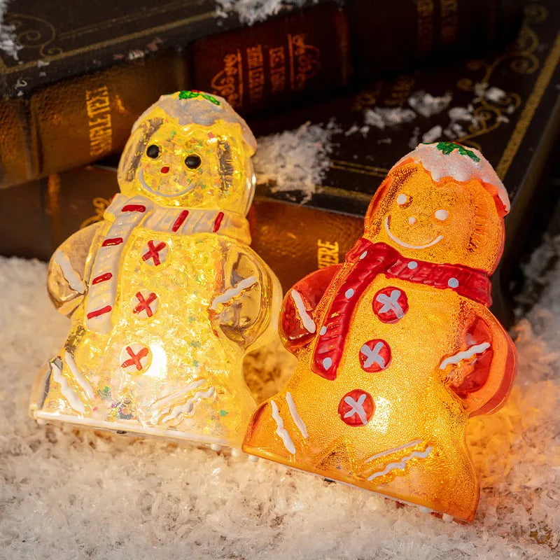 Glowing plastic gingerbread snowman Christmas ornament with a red scarf