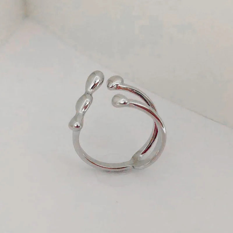 Brass fashion ring with spherical elements in circular design available in gold and silver colours