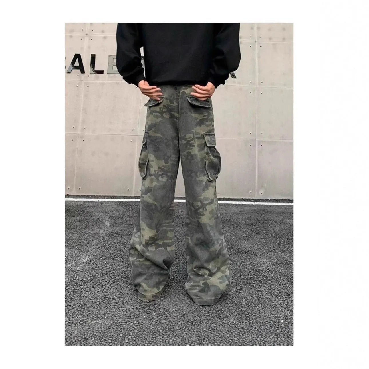 Men's washed camouflage cargo trousers with multiple pockets showing cotton blend fabric