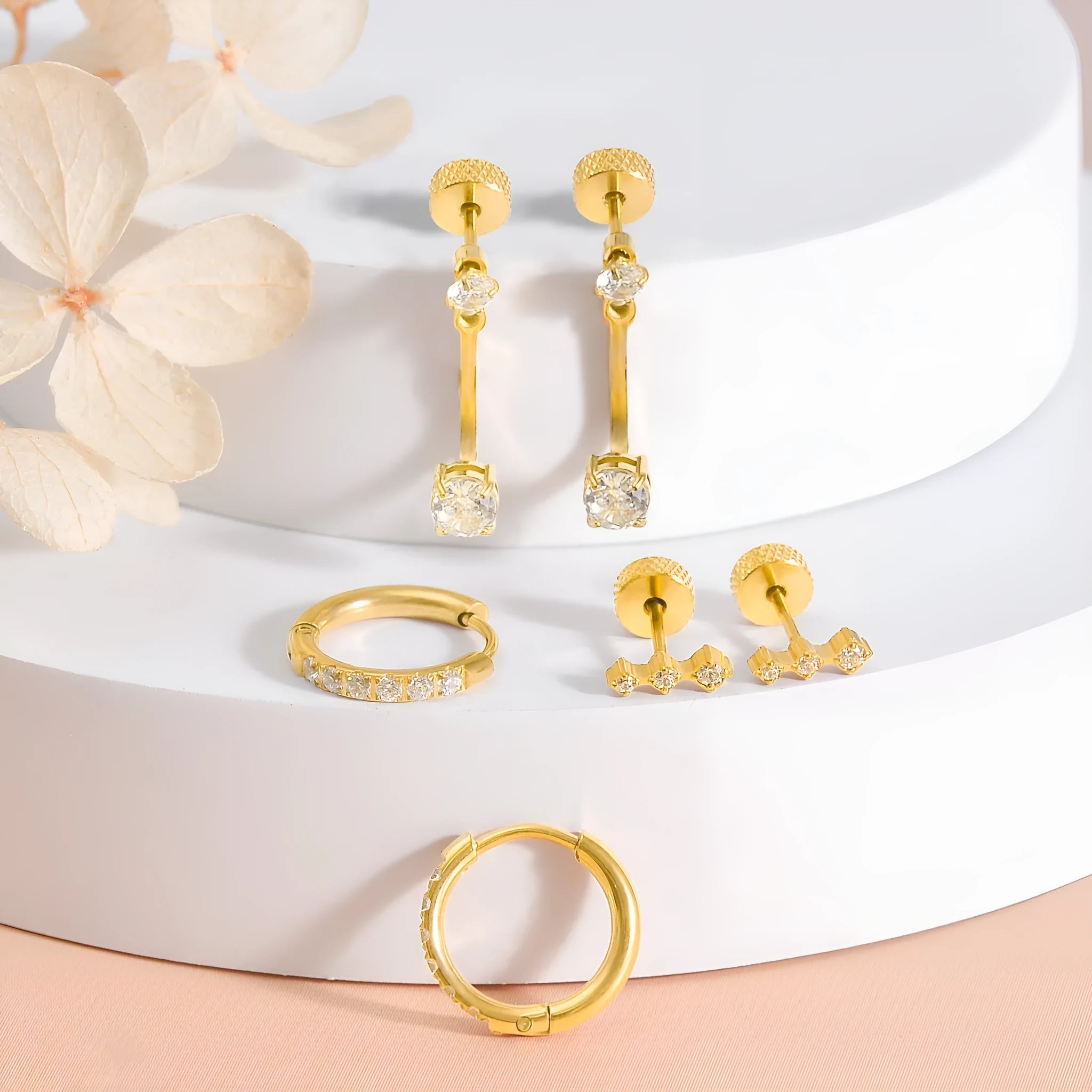 Set of three pairs titanium steel ring-shaped earrings with zircon inlay, steel colour finish
