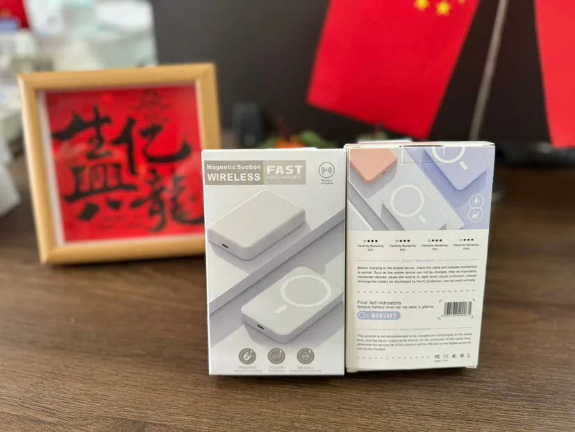 White magnetic wireless charging power bank with 5000mAh capacity on a table.