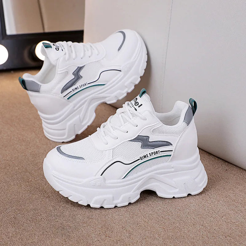 Women's white and beige height-increasing dad shoes with cross straps and lace-up front.