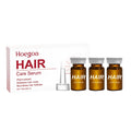 Three small 5ml bottles of nourishing hair root liquid treatment with ginger and rosemary oils.
